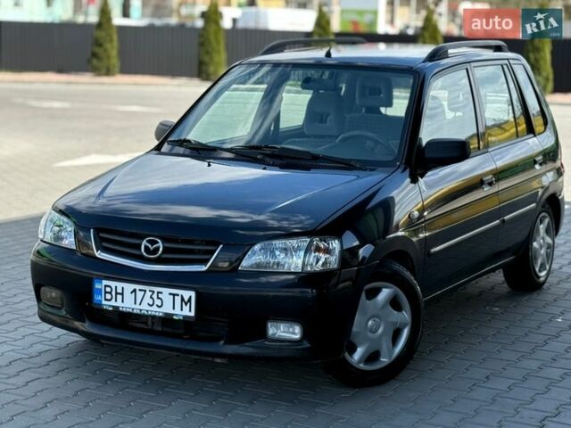 Черный Мазда Демио, объемом двигателя 1.5 л и пробегом 300 тыс. км за 2700 $, фото 1 на Automoto.ua