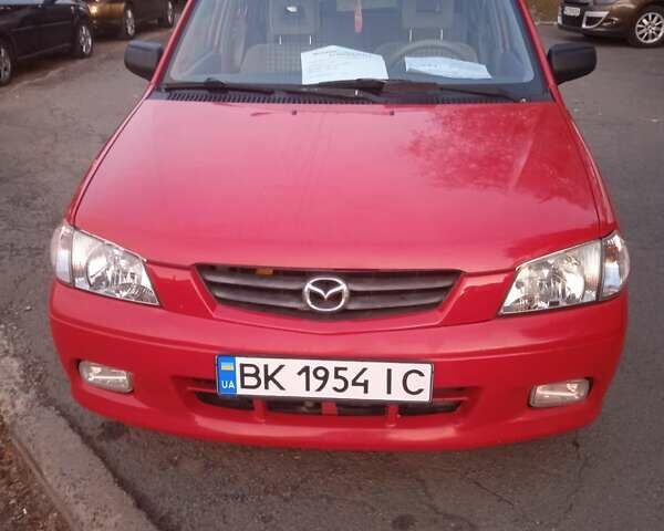 Красный Мазда Демио, объемом двигателя 1.5 л и пробегом 197 тыс. км за 3300 $, фото 1 на Automoto.ua