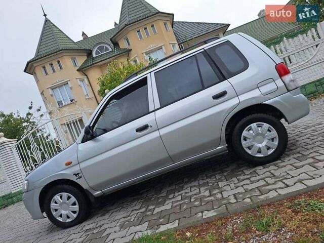 Серый Мазда Демио, объемом двигателя 1.3 л и пробегом 217 тыс. км за 1350 $, фото 1 на Automoto.ua