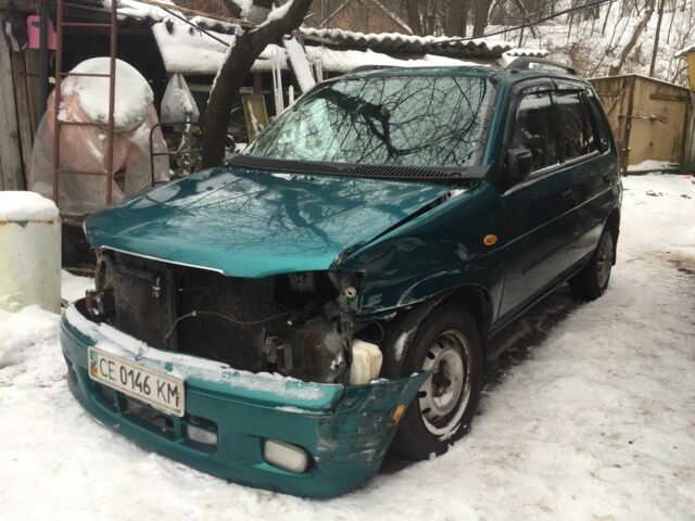 Зеленый Мазда Демио, объемом двигателя 1.3 л и пробегом 180 тыс. км за 1000 $, фото 1 на Automoto.ua