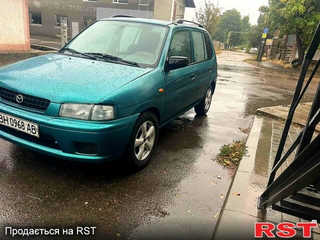 Зеленый Мазда Демио, объемом двигателя 1.3 л и пробегом 250 тыс. км за 1450 $, фото 1 на Automoto.ua