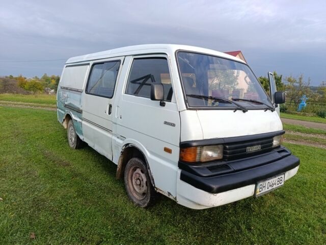 Білий Мазда E 2000, об'ємом двигуна 2 л та пробігом 564 тис. км за 850 $, фото 1 на Automoto.ua