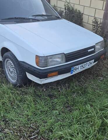 Белый Мазда Фамилия, объемом двигателя 1.5 л и пробегом 1 тыс. км за 700 $, фото 1 на Automoto.ua