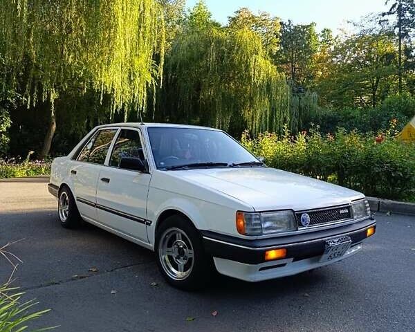 Белый Мазда Фамилия, объемом двигателя 1.5 л и пробегом 136 тыс. км за 5500 $, фото 1 на Automoto.ua