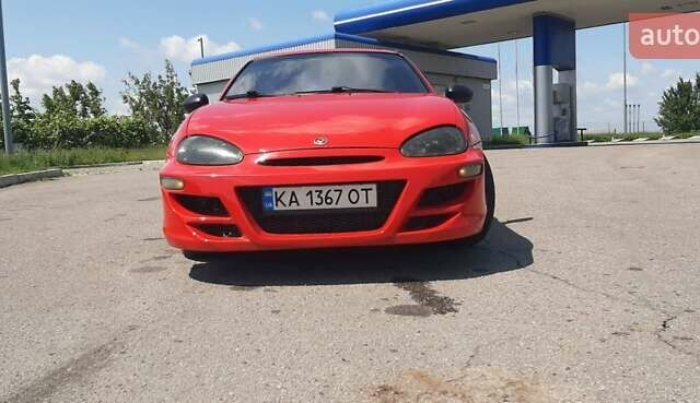 Красный Мазда МХ-3, объемом двигателя 1.8 л и пробегом 440 тыс. км за 3100 $, фото 1 на Automoto.ua