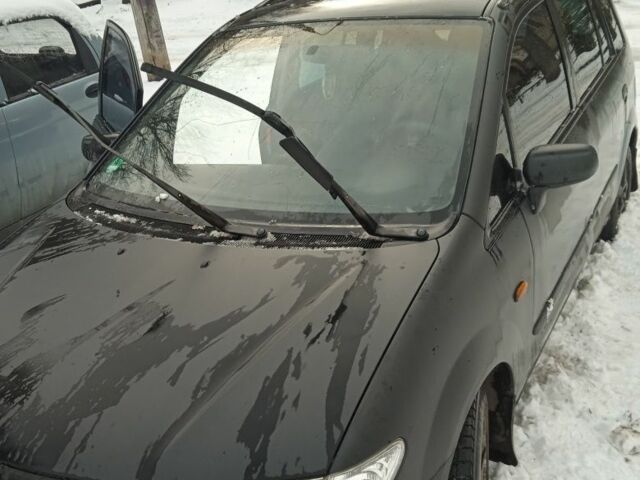 Черный Мазда Премаси, объемом двигателя 2 л и пробегом 244 тыс. км за 1064 $, фото 1 на Automoto.ua