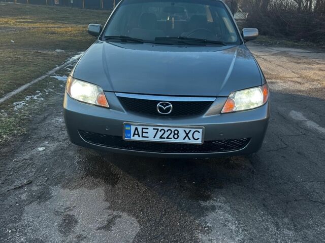 Серый Мазда Протеж, объемом двигателя 2 л и пробегом 245 тыс. км за 4200 $, фото 1 на Automoto.ua