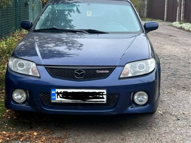 Синий Мазда Протеж, объемом двигателя 2 л и пробегом 298 тыс. км за 3700 $, фото 1 на Automoto.ua