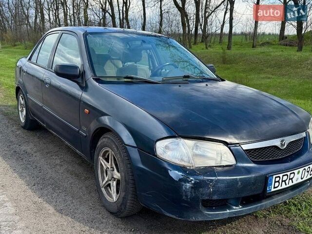 Синий Мазда Протеж, объемом двигателя 1.6 л и пробегом 286 тыс. км за 1400 $, фото 1 на Automoto.ua