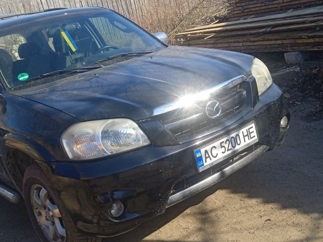 Черный Мазда Трибьют, объемом двигателя 2.3 л и пробегом 246 тыс. км за 6000 $, фото 1 на Automoto.ua