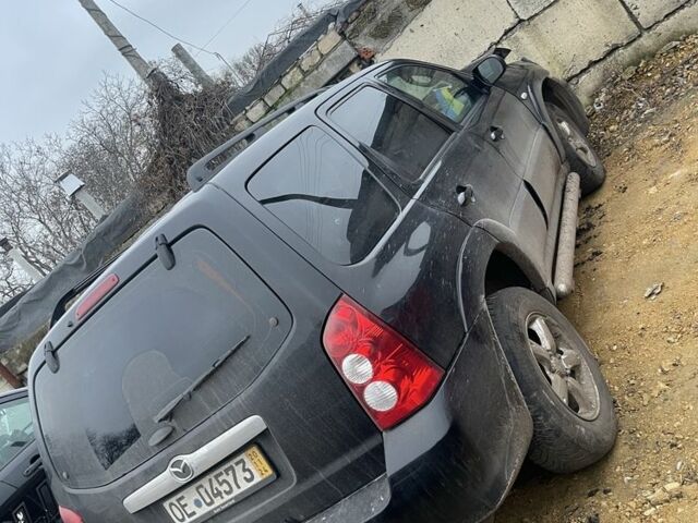 Чорний Мазда Трибьют, об'ємом двигуна 0 л та пробігом 200 тис. км за 1400 $, фото 1 на Automoto.ua