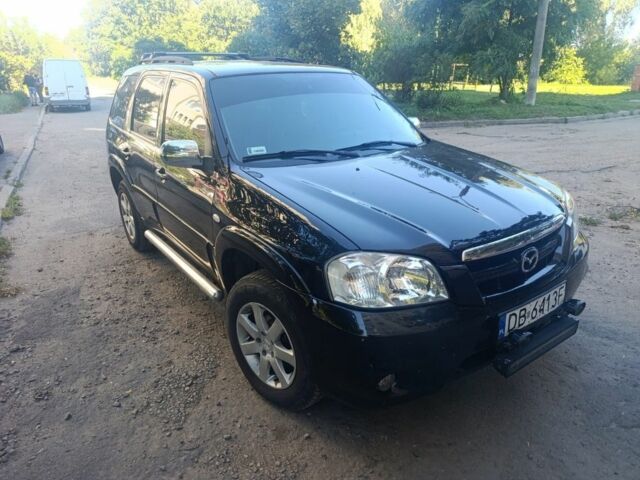 Чорний Мазда Трибьют, об'ємом двигуна 2 л та пробігом 222 тис. км за 6000 $, фото 1 на Automoto.ua