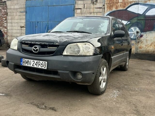 Серый Мазда Трибьют, объемом двигателя 2.5 л и пробегом 300 тыс. км за 1200 $, фото 1 на Automoto.ua