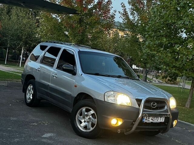 Сірий Мазда Трибьют, об'ємом двигуна 2 л та пробігом 230 тис. км за 3999 $, фото 1 на Automoto.ua