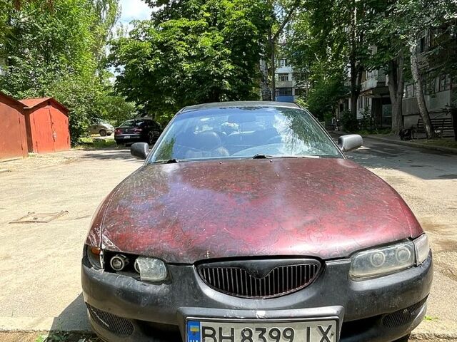 Червоний Мазда Кседос 6, об'ємом двигуна 2 л та пробігом 359 тис. км за 1300 $, фото 1 на Automoto.ua