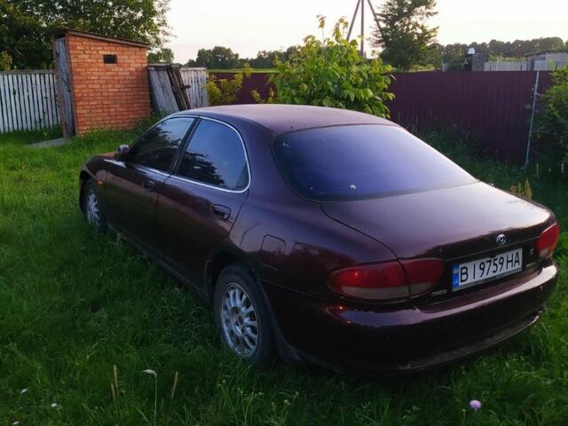 Червоний Мазда Кседос 6, об'ємом двигуна 2 л та пробігом 300 тис. км за 850 $, фото 1 на Automoto.ua