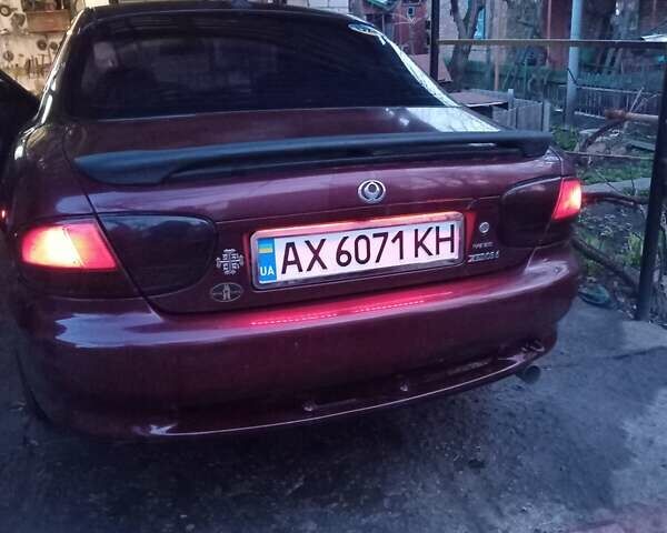 Червоний Мазда Кседос 6, об'ємом двигуна 2 л та пробігом 280 тис. км за 2800 $, фото 1 на Automoto.ua