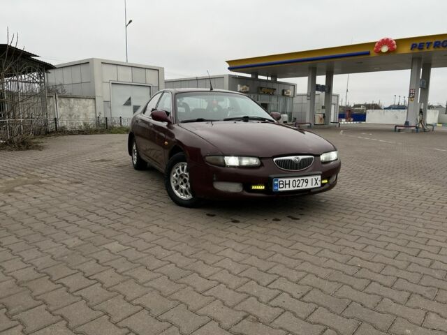 Червоний Мазда Кседос 6, об'ємом двигуна 1.6 л та пробігом 263 тис. км за 2100 $, фото 1 на Automoto.ua