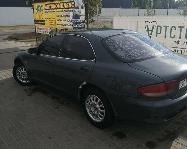 Серый Мазда Кседос 6, объемом двигателя 2 л и пробегом 372 тыс. км за 1700 $, фото 1 на Automoto.ua