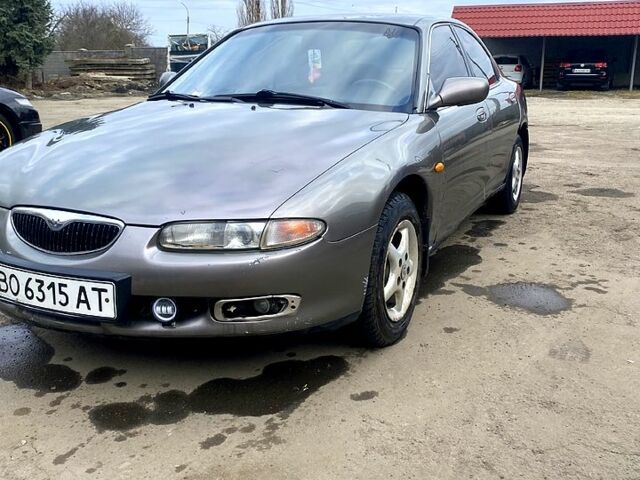 Серый Мазда Кседос 6, объемом двигателя 1.6 л и пробегом 310 тыс. км за 1700 $, фото 1 на Automoto.ua