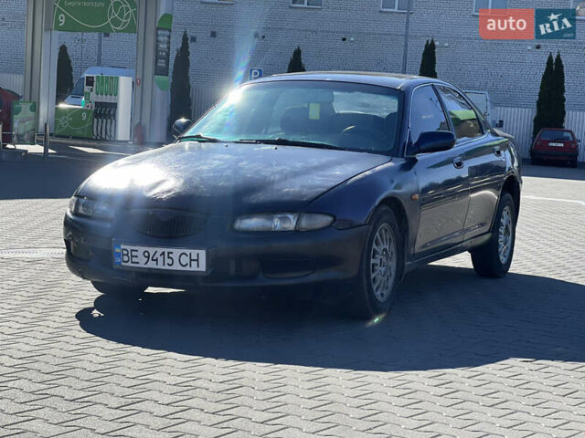 Синій Мазда Кседос 6, об'ємом двигуна 2 л та пробігом 325 тис. км за 920 $, фото 1 на Automoto.ua