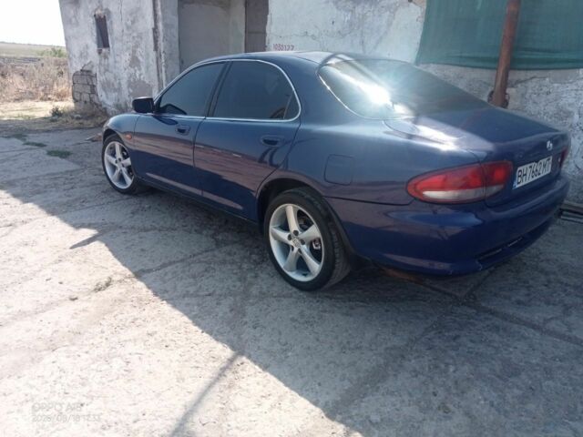 Синий Мазда Кседос 6, объемом двигателя 2 л и пробегом 245 тыс. км за 1800 $, фото 1 на Automoto.ua