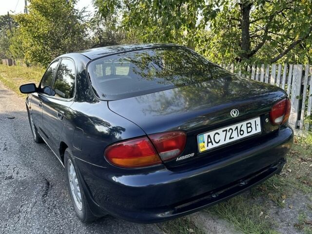 Синій Мазда Кседос 6, об'ємом двигуна 2 л та пробігом 380 тис. км за 1500 $, фото 1 на Automoto.ua