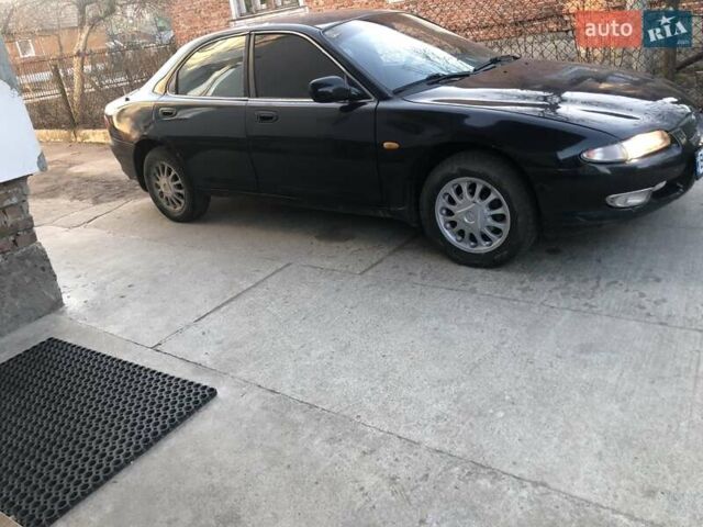 Синий Мазда Кседос 6, объемом двигателя 2 л и пробегом 300 тыс. км за 1350 $, фото 1 на Automoto.ua