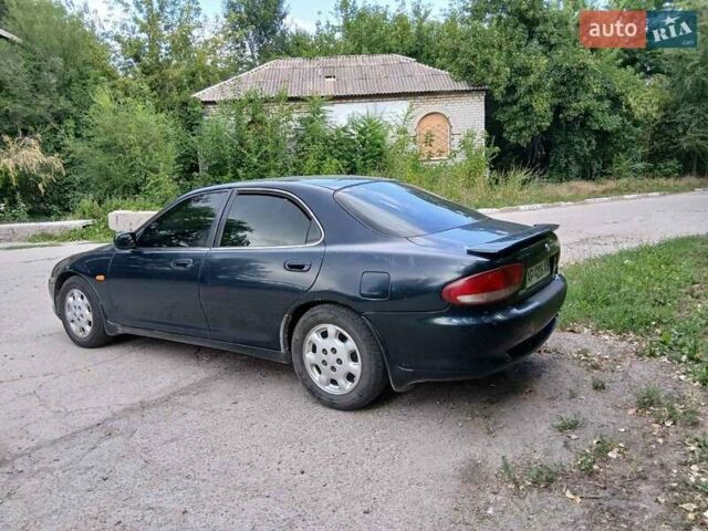 Зеленый Мазда Кседос 6, объемом двигателя 2 л и пробегом 300 тыс. км за 2062 $, фото 1 на Automoto.ua