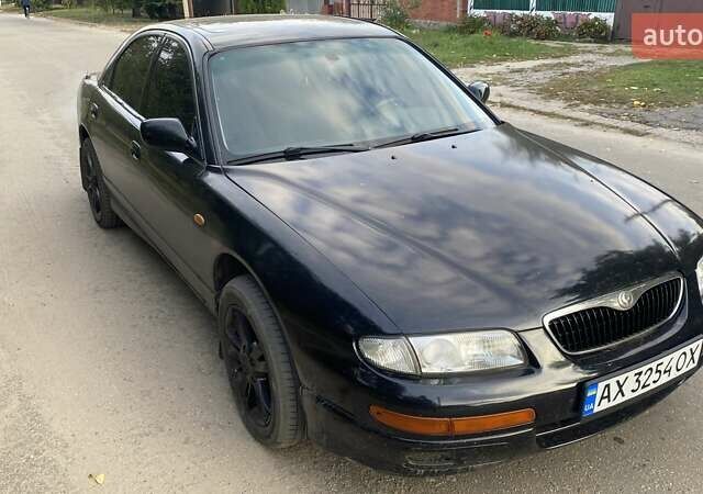 Черный Мазда Кседос 9, объемом двигателя 2 л и пробегом 347 тыс. км за 1900 $, фото 1 на Automoto.ua