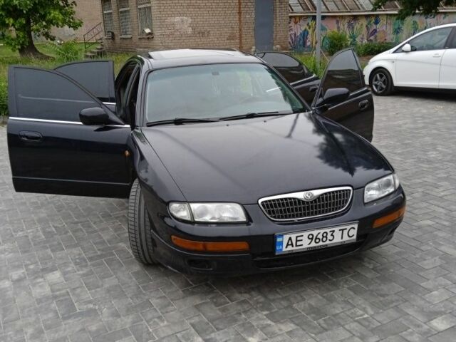 Чорний Мазда Кседос 9, об'ємом двигуна 2 л та пробігом 340 тис. км за 2800 $, фото 1 на Automoto.ua