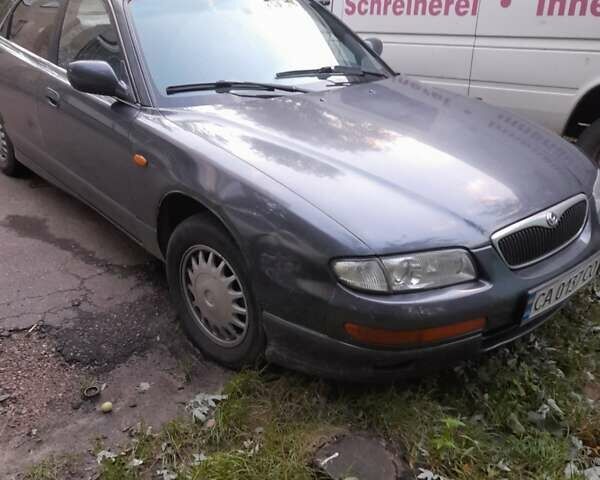 Чорний Мазда Кседос 9, об'ємом двигуна 2.5 л та пробігом 231 тис. км за 2000 $, фото 1 на Automoto.ua