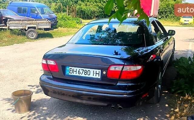 Чорний Мазда Кседос 9, об'ємом двигуна 2.5 л та пробігом 341 тис. км за 3500 $, фото 1 на Automoto.ua