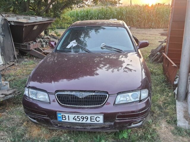 Червоний Мазда Кседос 9, об'ємом двигуна 2 л та пробігом 150 тис. км за 1000 $, фото 1 на Automoto.ua