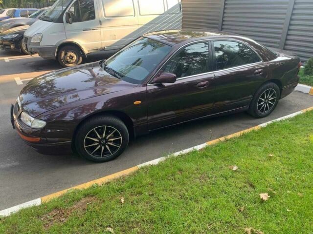 Красный Мазда Кседос 9, объемом двигателя 2 л и пробегом 390 тыс. км за 1600 $, фото 1 на Automoto.ua