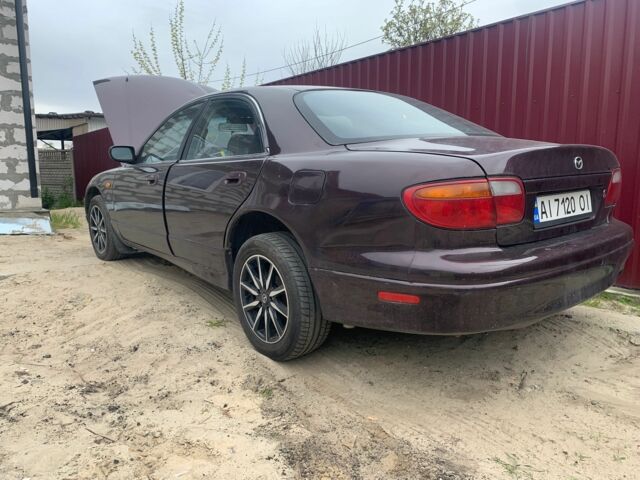 Червоний Мазда Кседос 9, об'ємом двигуна 2 л та пробігом 285 тис. км за 2000 $, фото 1 на Automoto.ua