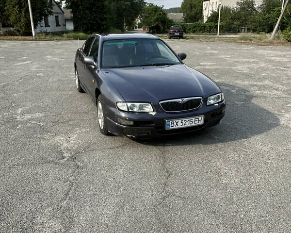 Серый Мазда Кседос 9, объемом двигателя 2 л и пробегом 350 тыс. км за 1420 $, фото 1 на Automoto.ua