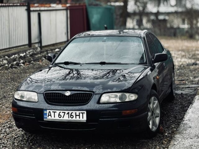 Синій Мазда Кседос 9, об'ємом двигуна 2 л та пробігом 407 тис. км за 1275 $, фото 1 на Automoto.ua