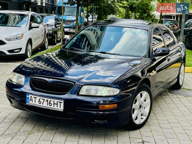 Синій Мазда Кседос 9, об'ємом двигуна 2 л та пробігом 405 тис. км за 1600 $, фото 1 на Automoto.ua