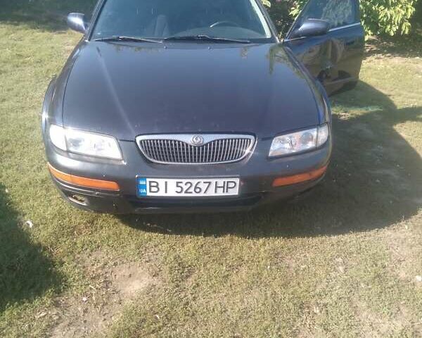 Синій Мазда Кседос 9, об'ємом двигуна 2 л та пробігом 280 тис. км за 2500 $, фото 1 на Automoto.ua