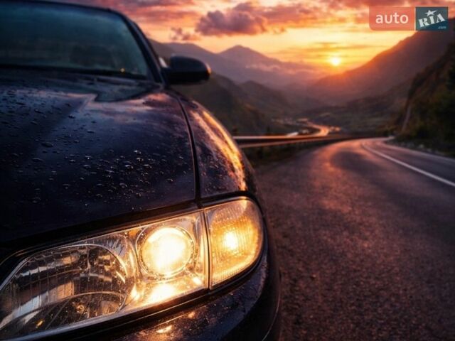 Синий Мазда Кседос 9, объемом двигателя 2.5 л и пробегом 297 тыс. км за 2500 $, фото 1 на Automoto.ua