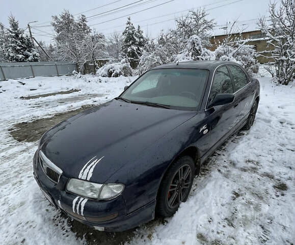 Синий Мазда Кседос 9, объемом двигателя 2.5 л и пробегом 340 тыс. км за 1800 $, фото 1 на Automoto.ua