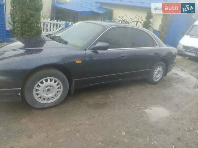 Синий Мазда Кседос 9, объемом двигателя 2.3 л и пробегом 297 тыс. км за 3000 $, фото 1 на Automoto.ua