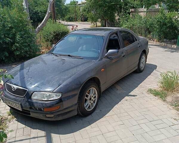 Синій Мазда Кседос 9, об'ємом двигуна 2.5 л та пробігом 300 тис. км за 1800 $, фото 1 на Automoto.ua