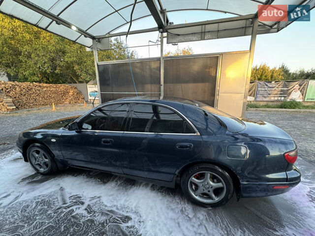 Синий Мазда Кседос 9, объемом двигателя 2.5 л и пробегом 288 тыс. км за 3500 $, фото 1 на Automoto.ua