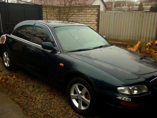 Зеленый Мазда Кседос 9, объемом двигателя 2 л и пробегом 300 тыс. км за 2300 $, фото 1 на Automoto.ua