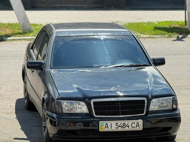 Черный Мерседес Ц-Класс, объемом двигателя 2.3 л и пробегом 420 тыс. км за 2900 $, фото 1 на Automoto.ua