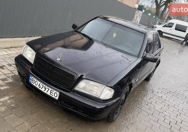 Чорний Мерседес Ц-Клас, об'ємом двигуна 2 л та пробігом 260 тис. км за 2598 $, фото 1 на Automoto.ua