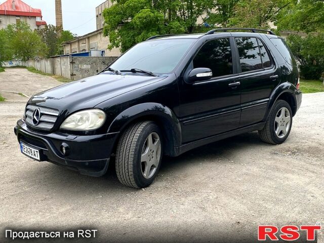 Чорний Мерседес ML-Class, об'ємом двигуна 5.4 л та пробігом 124 тис. км за 12000 $, фото 1 на Automoto.ua