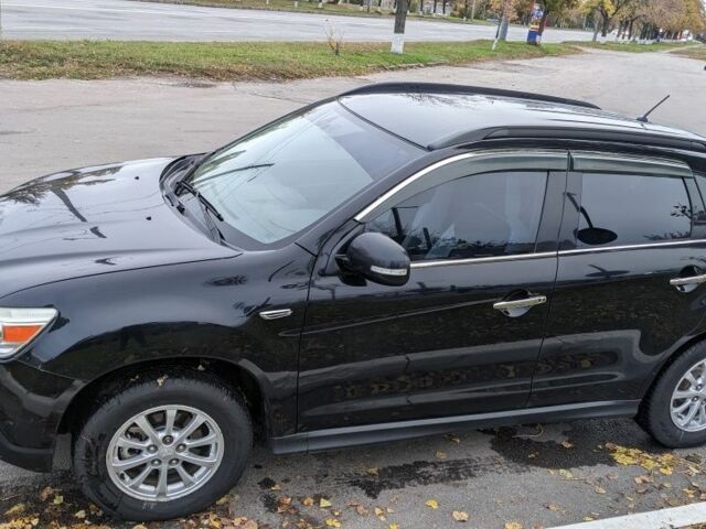 Черный Мицубиси АСХ, объемом двигателя 1.8 л и пробегом 140 тыс. км за 11200 $, фото 1 на Automoto.ua